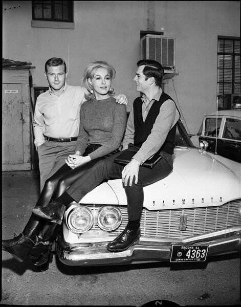 0000 Martin Milner (Route 66), Julie Newmar (BatWoman) and 1960 Plymouth.jpg