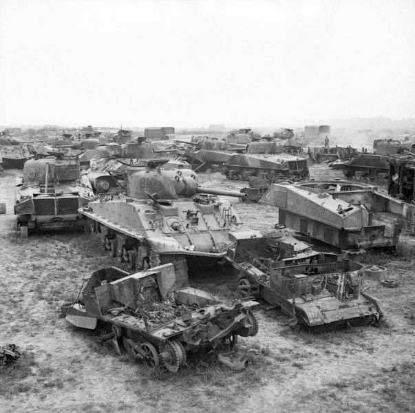 0000000 British scrapyard of Shermans and other vehicles in Normandy, less than a month after ...jpg