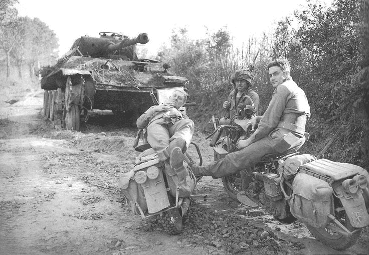 0000000 Private David Wise of Chambersburg, Pennsylvania, stretches on his motorcycle next to ...png