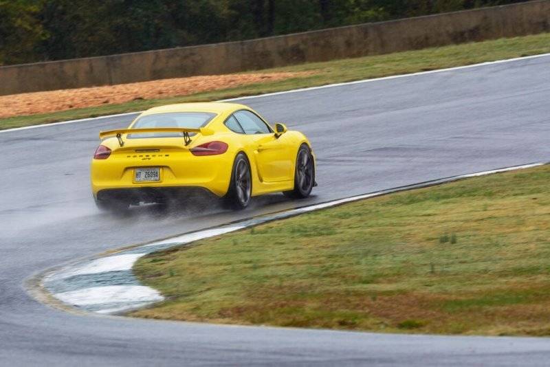 2016 Porsche Cayman GT4 Yellow rear.jpg