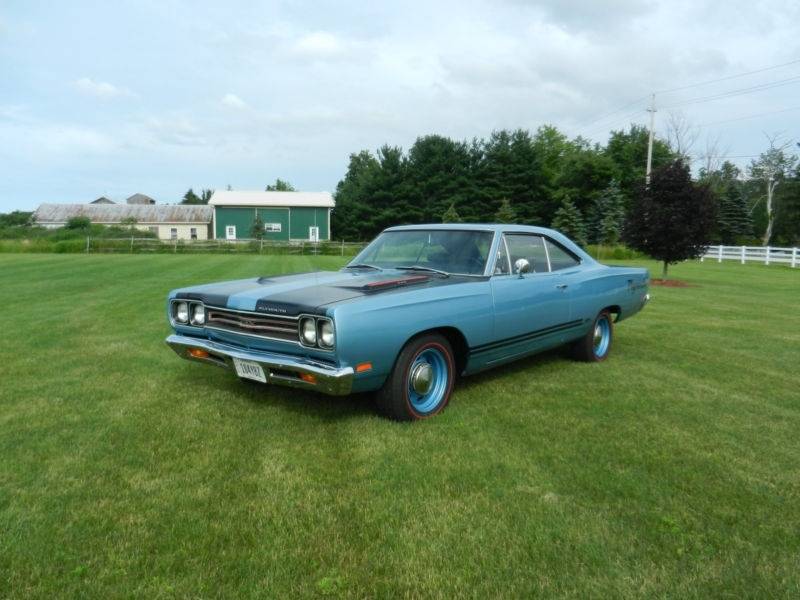 69 GTX blue with black lower double stripes & poverty dog dish hubcaps.jpg