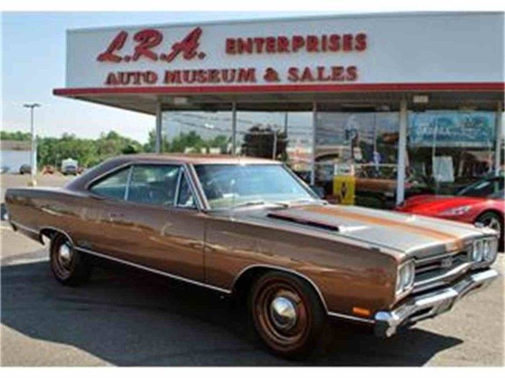 69 GTX bronze & black with red pinstripe & poverty dog dish hubcaps.jpg