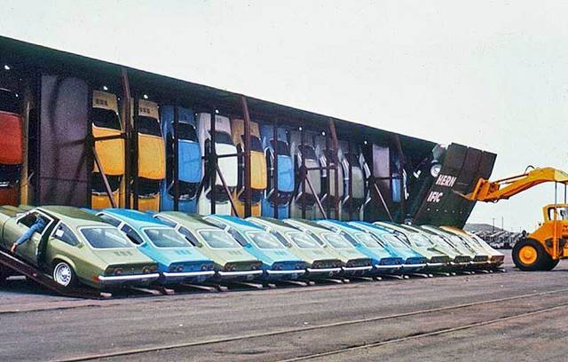 71 Vega Advert. #3 Hatchbacks loaded in train box cars.jpg