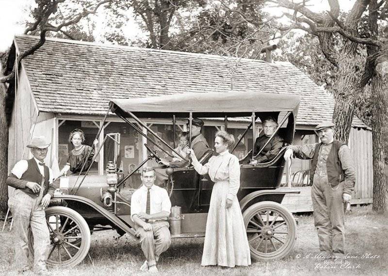 A family from Minnesota showing off their new car, circa early 1900s.jpg