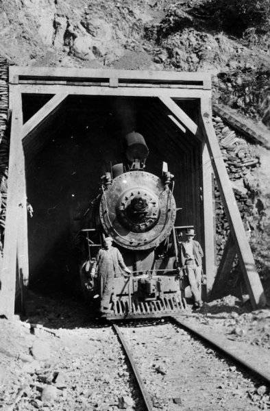 A-train-emerging-into-the-north-shore-of-Lake-Crescent-under-a-tunnel-built-by-the-Spruce-Pro...jpeg