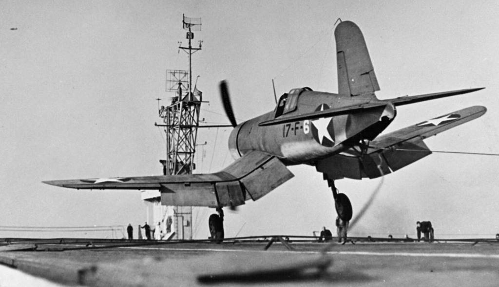 F4U-1_VF-17_landing_on_USS_Charger_%2528CVE-30%2529_1943+web.jpg