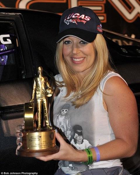 Lynsi Torres-Snyder In & Out Burger Heirist with her NHRA Wally.jpg