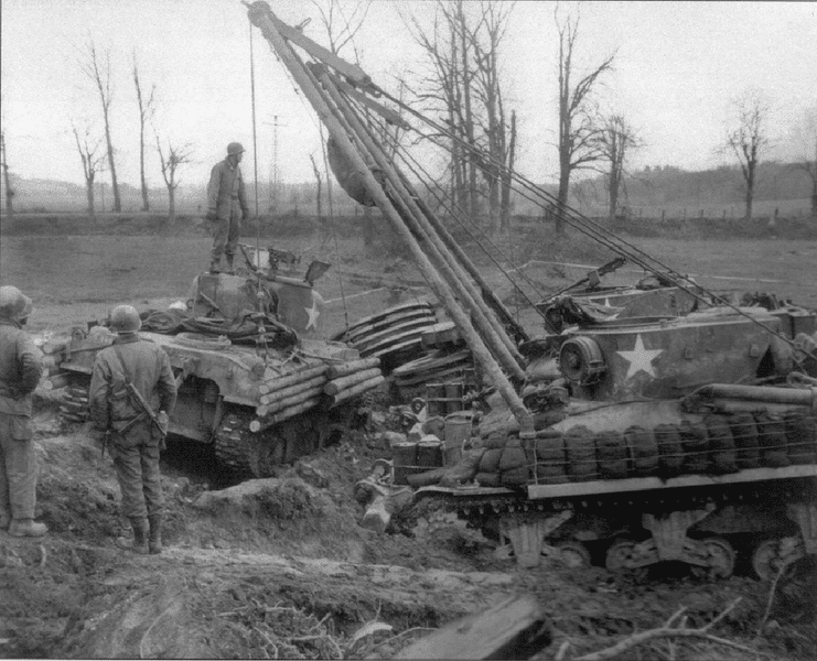 M32-19dec-1944-recovering-mine-rolling-tank-on-German-Frontier-more-recovery-help.png