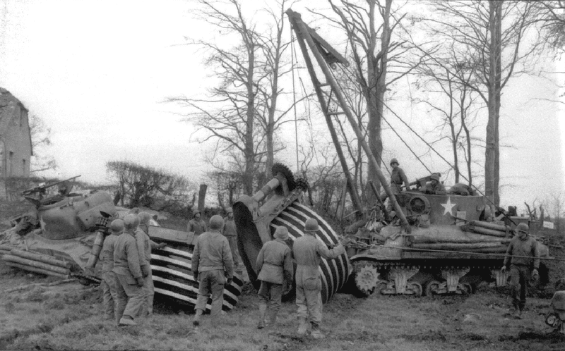 M32-19dec-1944-recovering-mine-rolling-tank-on-German-Frontier.png