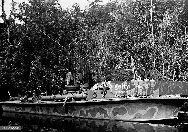 ne-of-the-us-navys-fleet-of-pt-boats-rides-at-anchor-under-netting-picture-id615313234?s=612x612.jpg