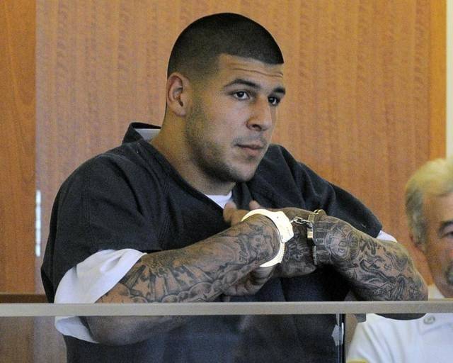 NE Patriots TE Aaron Hernandez Murder in cuffs.jpg