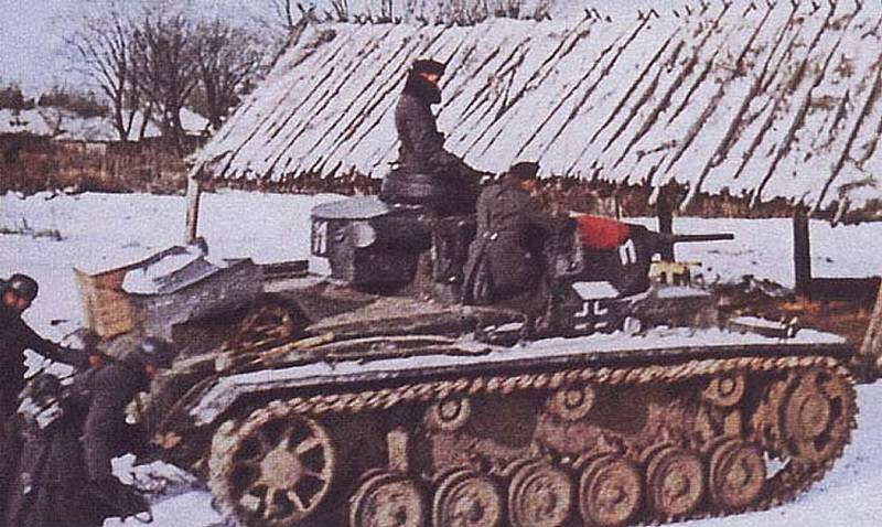 Panzer-III-tank-on-the-rise-in-a-Russian-village.jpg