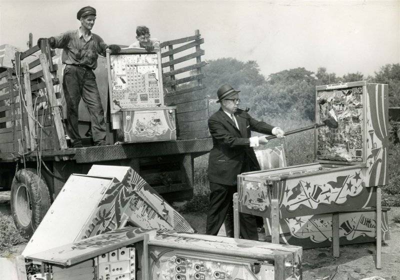 Pinball machines being destroyed during the pinball prohibition. They were banned in NYC as we...jpg