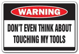 Sign warning don't even think of touching my tools.jpg