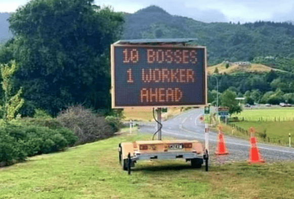 Smiley A warning union Job sign - 10 bosses & 1 worker ahead.png