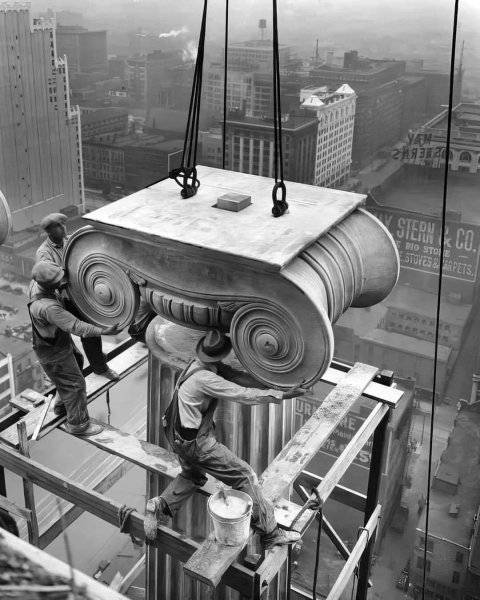 Workers installing a Greek Ionic column at the Civil Courts Building in St. Louis, Missouri c....jpg