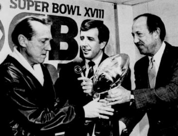 Oakland Raiders AFL 1984 Al Davis excepting the Super Bowl Trophy # XVIII from NFL Comissioner P.jpg