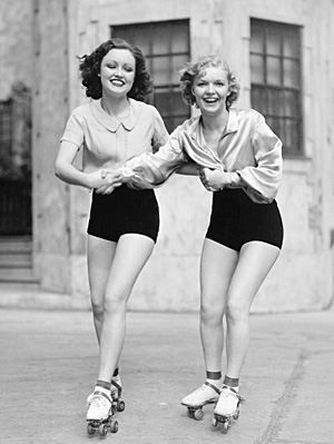 vintage-black-and-white-young-women-roller-skating-friends.jpg