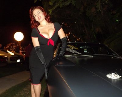 Car Babe with a 70 Daytona Charger at the Playboy Mansion.jpg